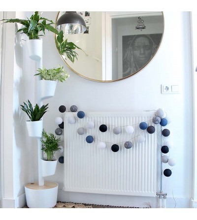 white vertical planter with purifying plants