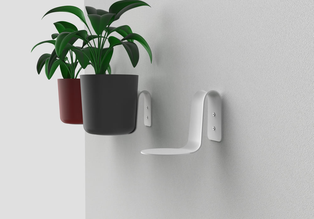 The collaborative design process for the pot hanging system, highlighting the focus on simplicity and functionality.